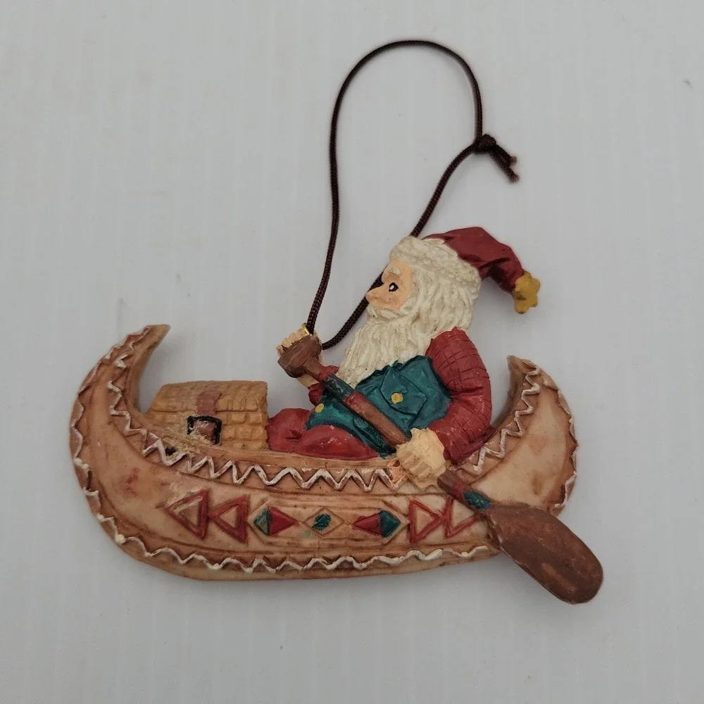 Kurt Adler Santa Claus Paddling Canoe Folk Art Christmas Ornament Resin Vintage
